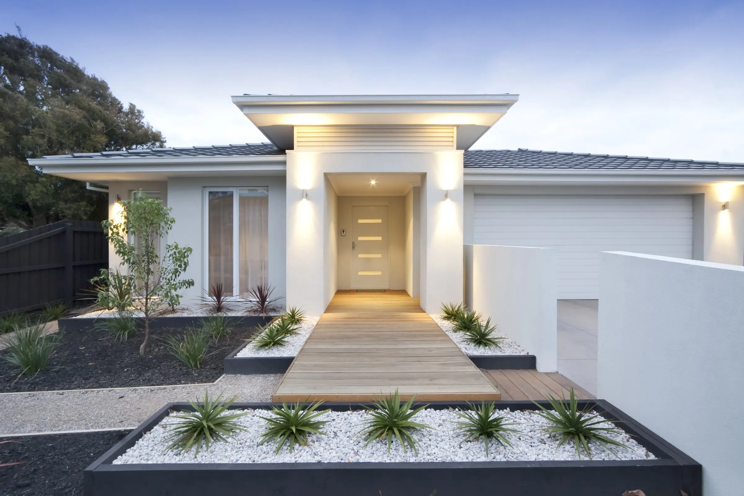 Hume BAL40 bushfire-rated entrance door and frame on a Perth-style home at dusk